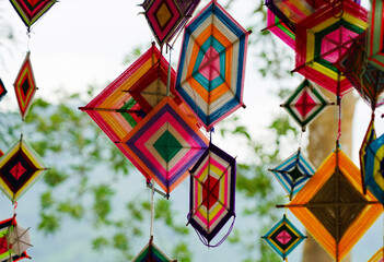 Lanna flags are hung decorated with hexagonal flags in celebrations by colorful yarn at Thai temple