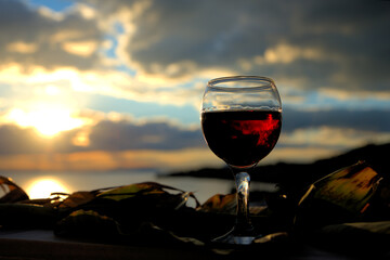 red wine in a glass at sunset,summer wine