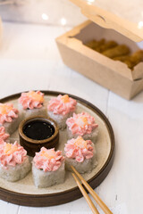 Sushi roll with pink cream, salmon