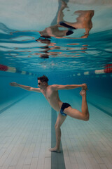underwater yoga in the pool, meditation and relaxation pose