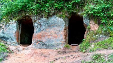 Anfabrika Rocks and Cellars in Ligatne Town an Old Floodgate Dam. Ancient Sandstone Caves and Ancient Chambers in Gauja National Park, Latvia