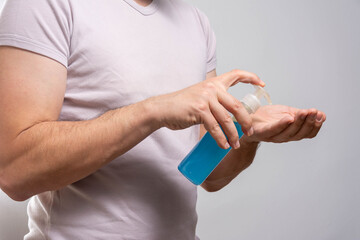 Hand sanitizer man applying sanitizing gel liquid rubbing hands 