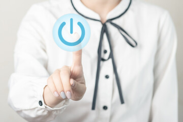Women's hands press the enable button, business technology concept