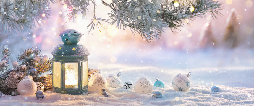 Christmas Lantern On Snow With Fir Branch In The Sunlight. Winter Decoration Background