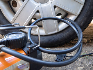 pump up the autowheel compressor on the road. car electro pump.