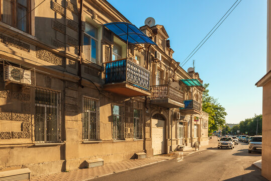 Revolution street in the old district of Yevpatoria, a narrow street with two-story buildings