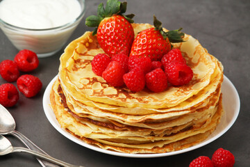 Russian cuisine national dish bliny with fresh berries	