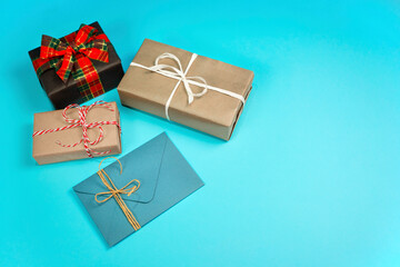 Four gifts black, blue and craft on a blue background.