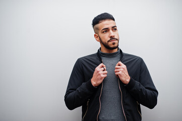Portrait of stylish arab beard man wear grey turtleneck and black jaket. Arabian model guy against...