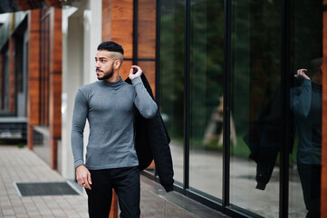 Portrait of stylish arab beard man wear grey turtleneck and black jaket. Arabian model guy.