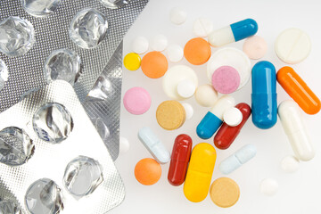 Capsules with vitamin packed insulated on white background.