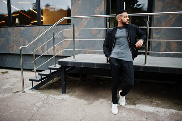 Portrait of stylish arab beard man wear grey turtleneck and black jaket. Arabian model guy.