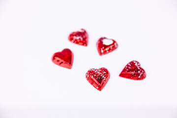 heart shaped chocolate candies on a white background

