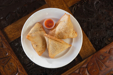Samosa take away with red sauce