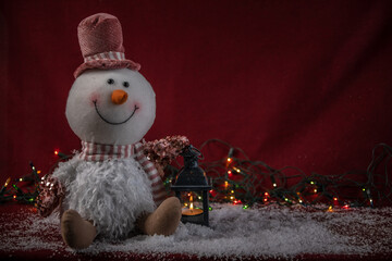 snowman with candle and lights