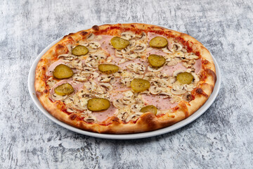 fresh pizza on the white plate