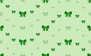 Seamless pattern of large and small green bow symbols. The elements are arranged in a wavy. Vector illustration on light green background