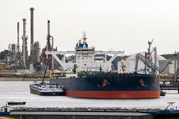 Fototapeta premium Oil tankers moored near a petrochemical plant in the Port of Rotterdam.