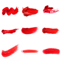Red colored brush stroke paiting over isolated background, canvas watercolor texture, red lipstick smudge