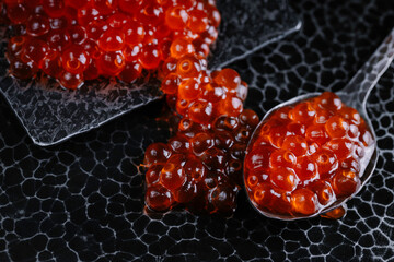 Delicious red caviar. Healthy eating, diet, sea food concept. Vintage metal background.
