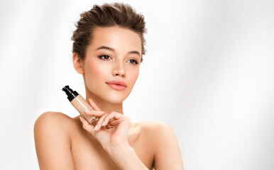 Woman with liquid foundation. Photo of woman with perfect makeup on white background. Beauty concept