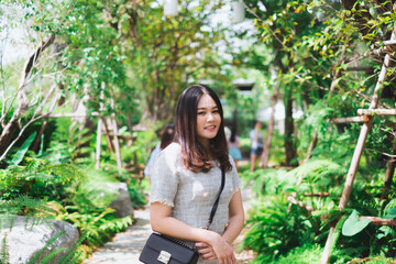 Asian Women in Green Forest in Thailand. 