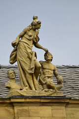 Sculpture of a man and a woman with a hammer and chisel