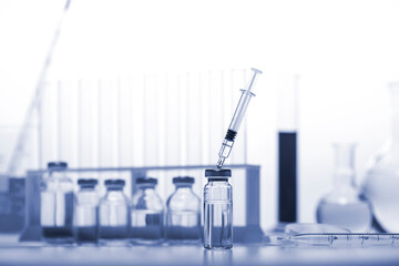 Test-tubes on a white and blue background.