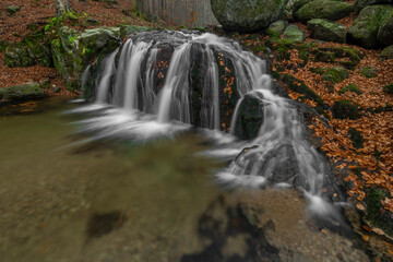 Maly Bily Stolpich waterfall in autumn fresh morning in Jizerske mountains