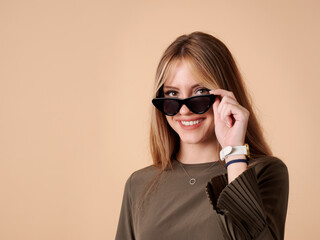 Fototapeta premium Pretty young woman with cheerful fitness and wearing sunglasses