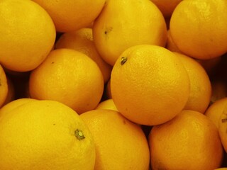 pile of unpeeling and not arrange fresh ripe orange SELECTIVE FOCUS 