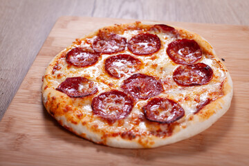 Delicious hot homemade Pepperoni pizza. Italian Pepperoni pizza with salami, close up