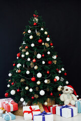 New Year's decor holiday Christmas interior of the Christmas tree pine tree gifts