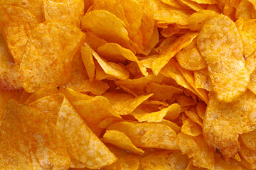 Potato chips or crisps . Close-up of potato chips or crisps. Food background. - obrazy, fototapety, plakaty