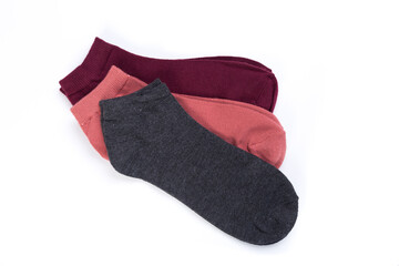 several pairs of short socks on a white background, top view