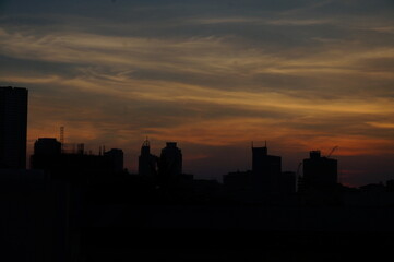 Fototapeta na wymiar Manila Sunset on top of a commercial building
