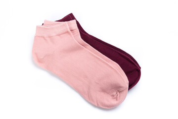 two pairs of colored short socks on a white background, top view