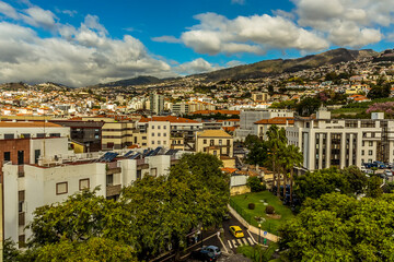 Fototapeta na wymiar A view of across the roof tops of Funchal, Madeira from the chair lift