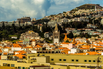 A view of across the roof tops of Funchal, Madeira from the chair lift up the hill behind the city