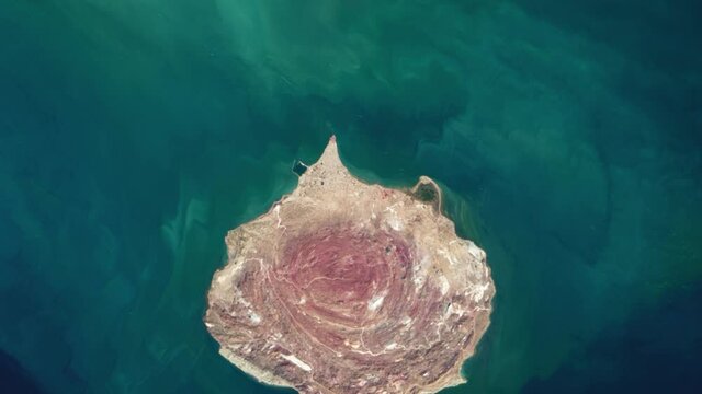 Scenic colors island satellite aerial view pink rocks in Hormuz island Iran in Persian gulf animation. Images furnished by Nasa