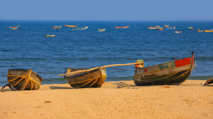 Colorful fishermen boats at Rushikonda beach near Visakhapatnam city in India. - Powered by Adobe