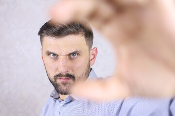 Fototapeta premium man showing sign with fingers