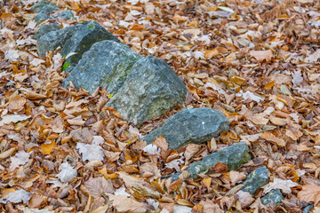 Untreated rough natural stone in everyday environment, gardening and landscaping