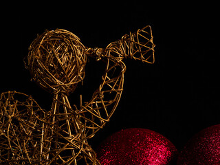ANGEL ANNOUNCER ON BLACK BACKGROUND WITH CHRISTMAS BALLS