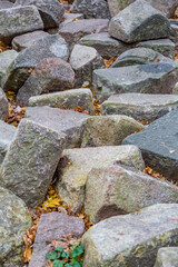Untreated rough natural stone in everyday environment, gardening and landscaping