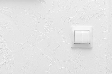 Light switch on white background, copy space