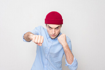 Naklejka premium Single-minded man is ready to fight with his fists, portrait
