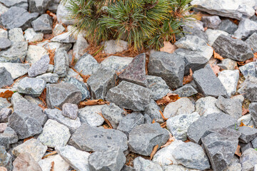 Untreated rough natural stone in everyday environment, gardening and landscaping