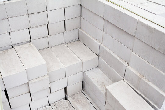 White silicate brick is laid. Stack of silicate bricks for construction
