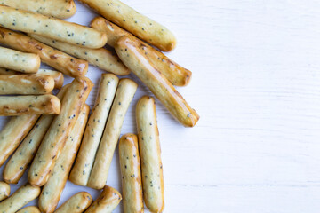 Sticks with poppy seeds on a white background with space for text. Packaging, poster.